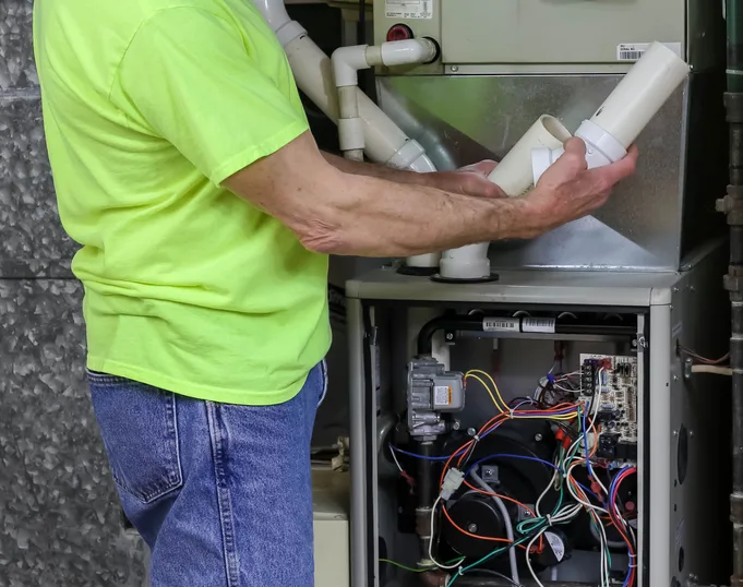 High-efficiency gas furnace installed in a utility closet