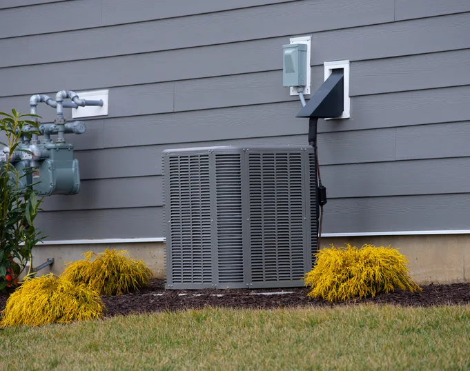 Ducted heat pump system installed beside a Venice, FL home